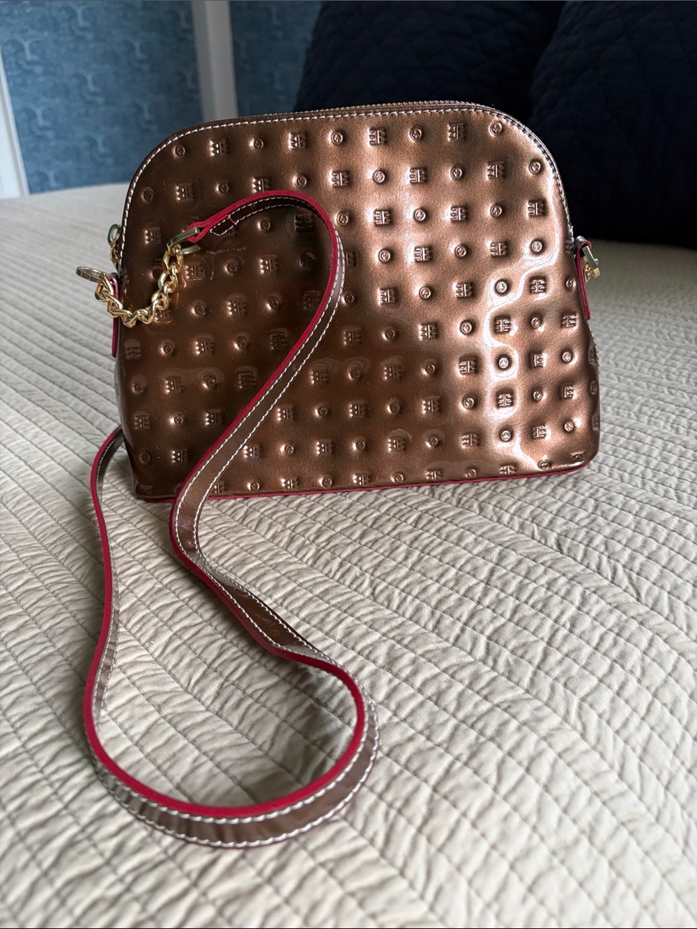Arcadia Metallic Copper Crossbody Bag with Red-Trim Strap